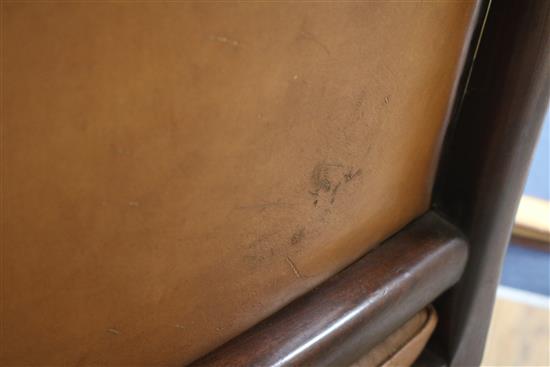 A leather button back bergere chair